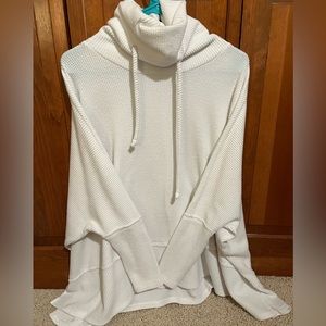 Cherish, oversized white turtle neck sweater.